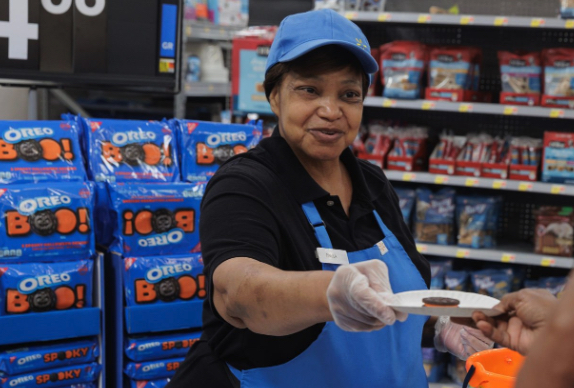 Walmart employee distributing samples